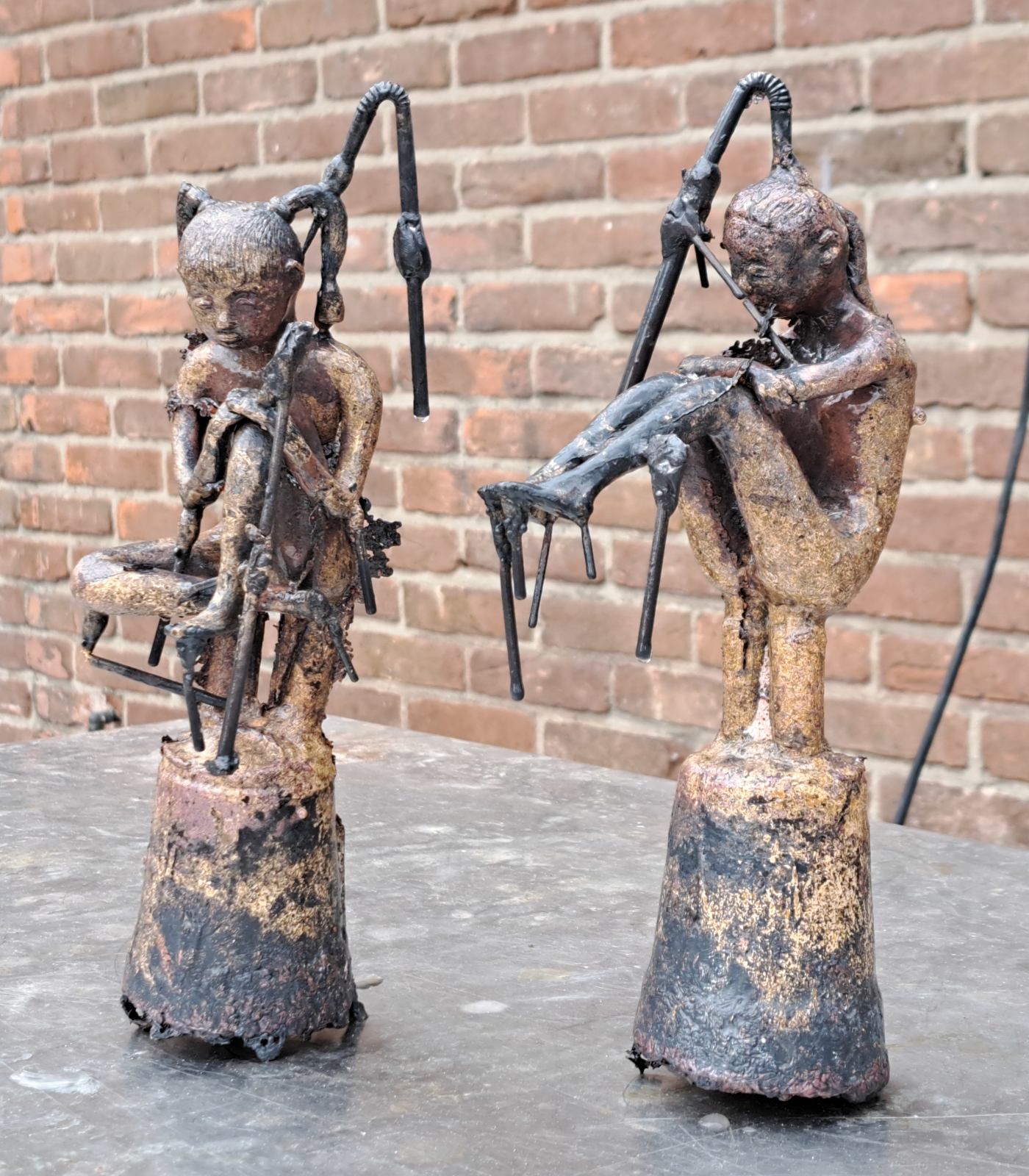 Bronze figures after casting