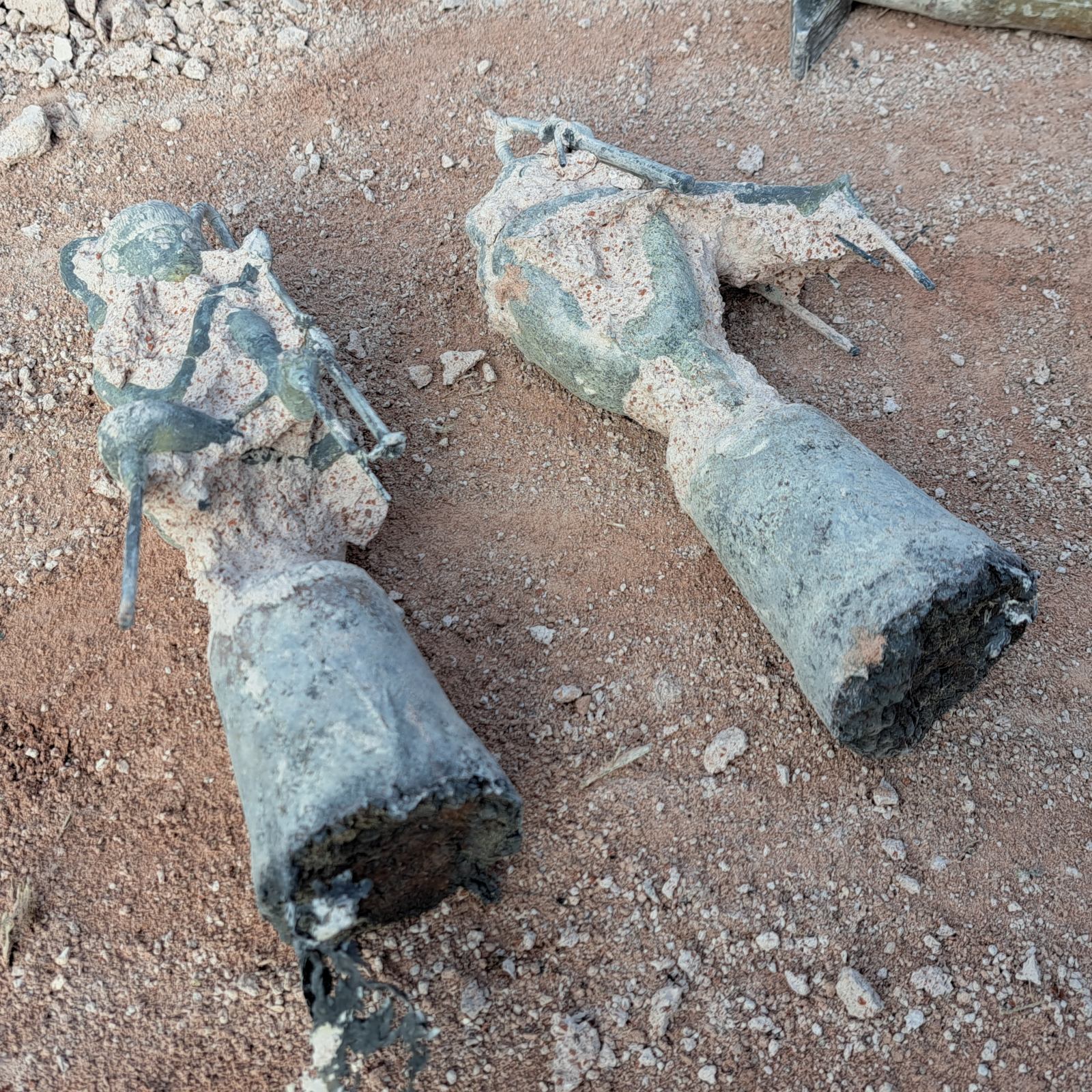 Bronze figures after casting with remainder of plaster investment