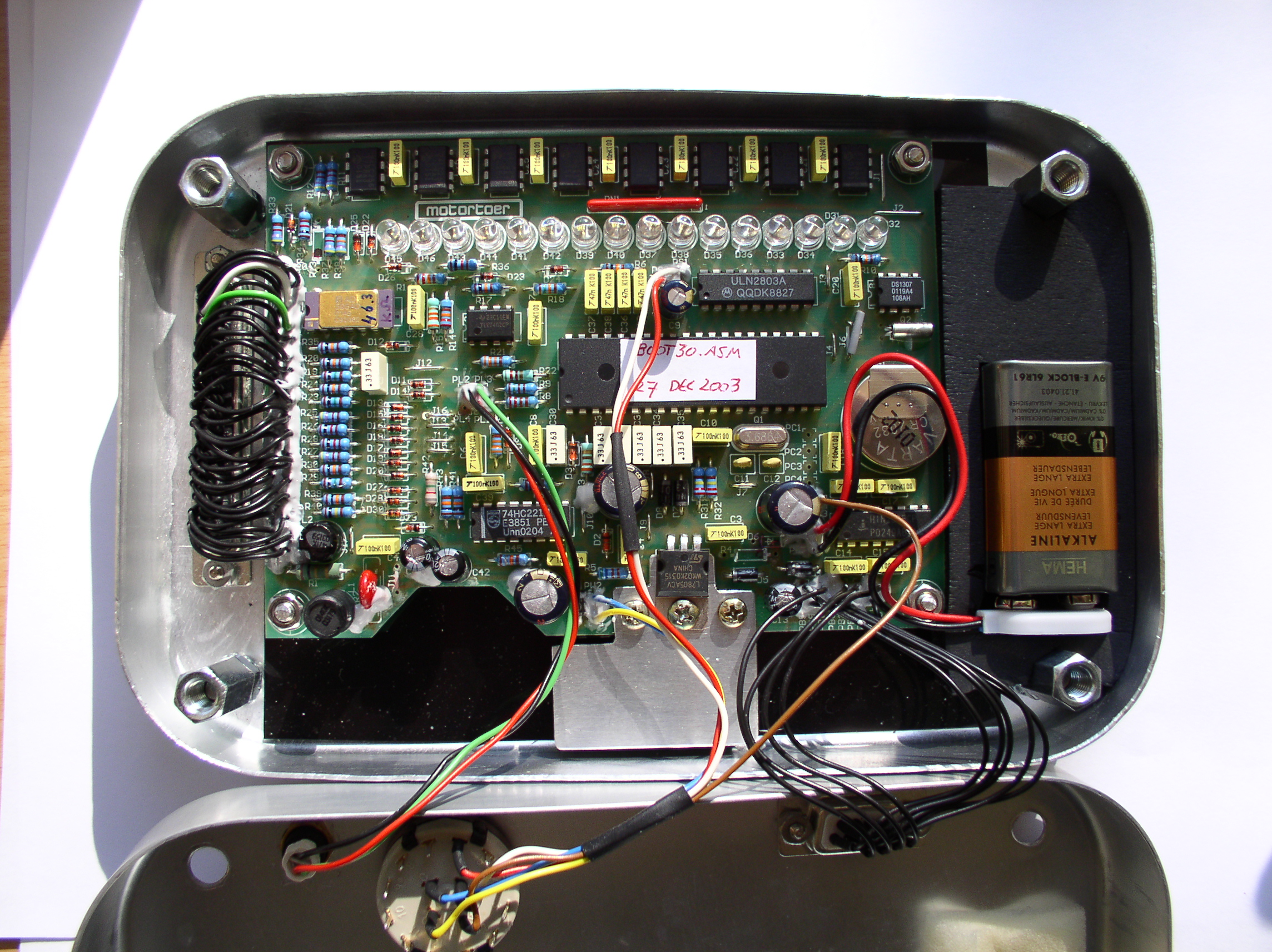 Inside view of a motorcycle datalogger showing the electronics