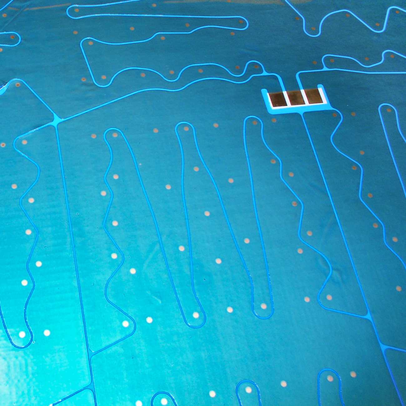 Detail of patterned conductive backsheet for MWT solar panels