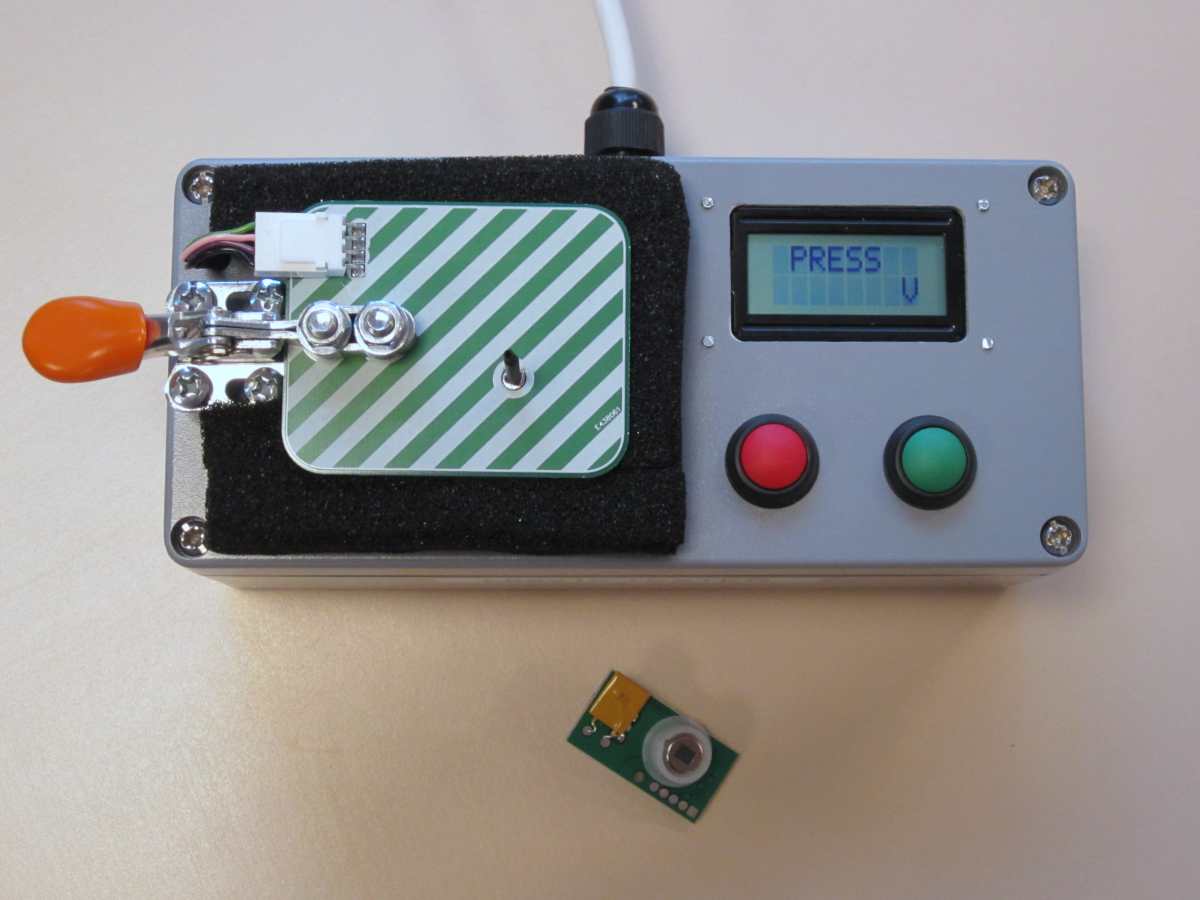 Production programmer/tester equipment for small passive infrared motion detector