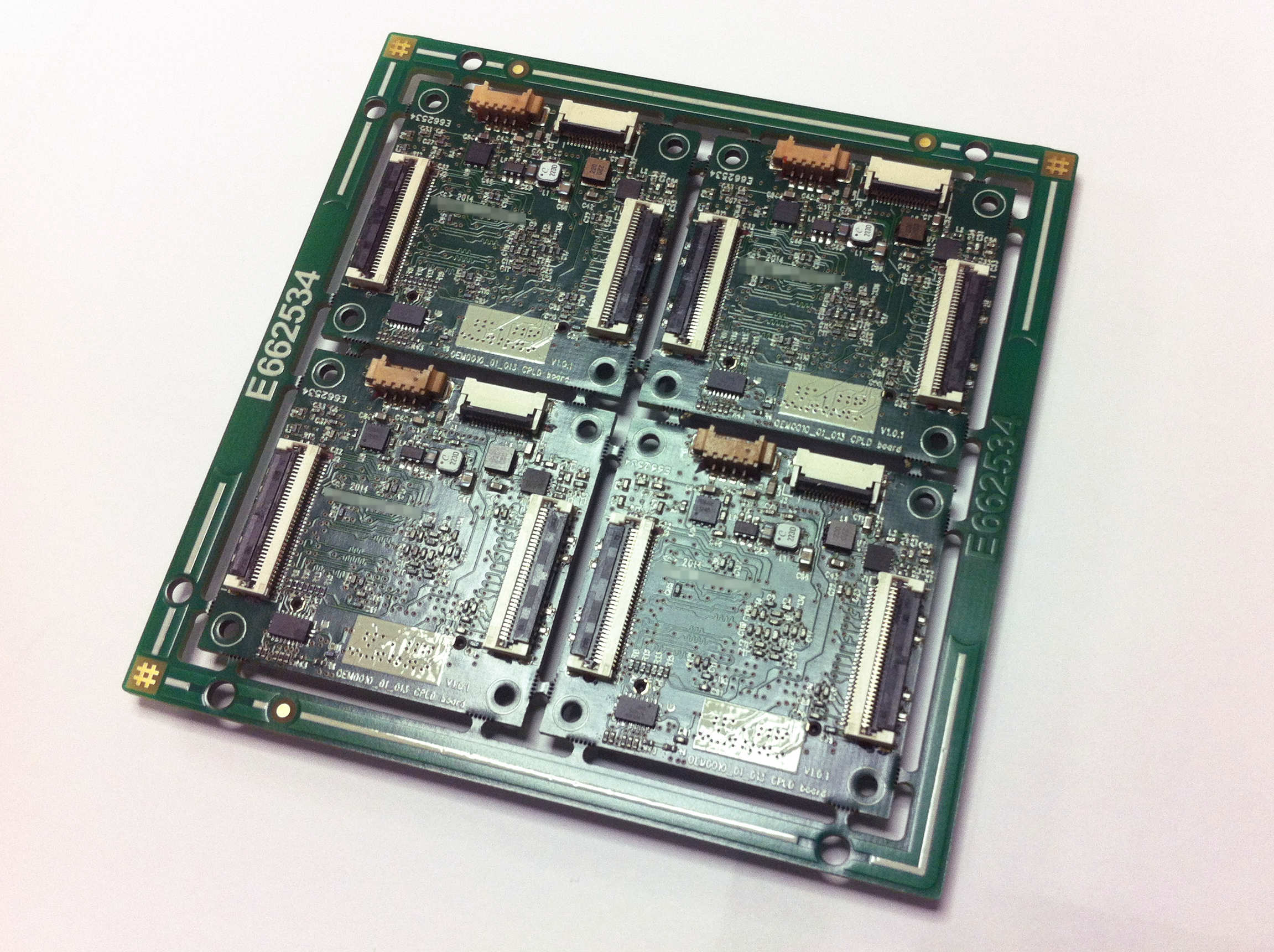 Rear-side view of panel of four CPLD PCBs