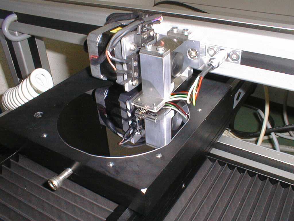 A round wafer being measured in the surface resistance scanner