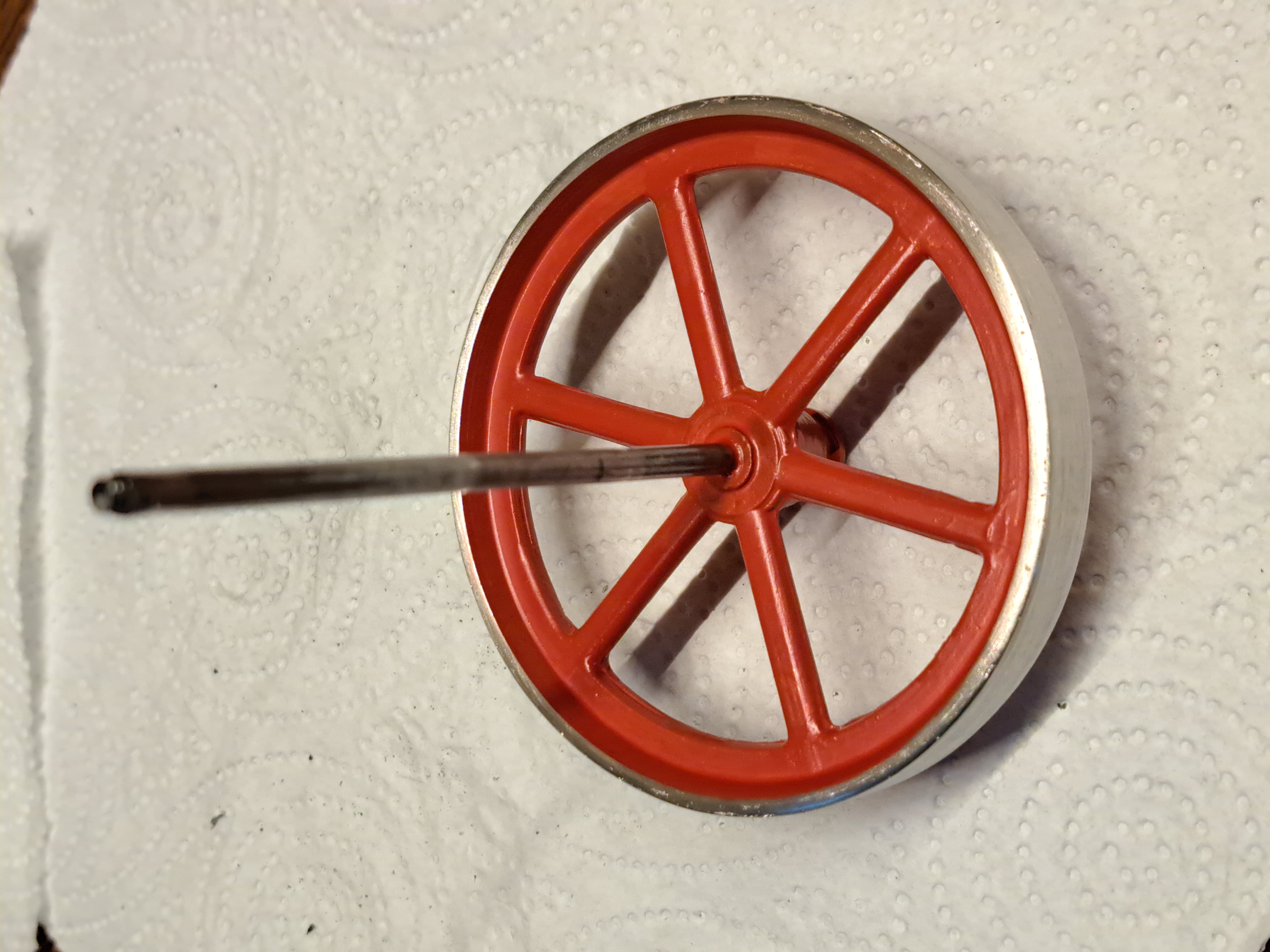 Toy steam engine flywheel